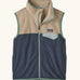 Patagonia Kids Micro D Snap-T Fleece Vest in Smolder Blue with Oar Tan. Navy blue lower body panel, camel beige upper panel, and sage green binding with a matching chest pocket flap.