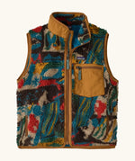 Patagonia Kids Retro X Fleece Vest in Lets Chat, Den Brown. Soft fleece in a Multicoloured abstract pattern, brown binding, and a matching chest pocket.