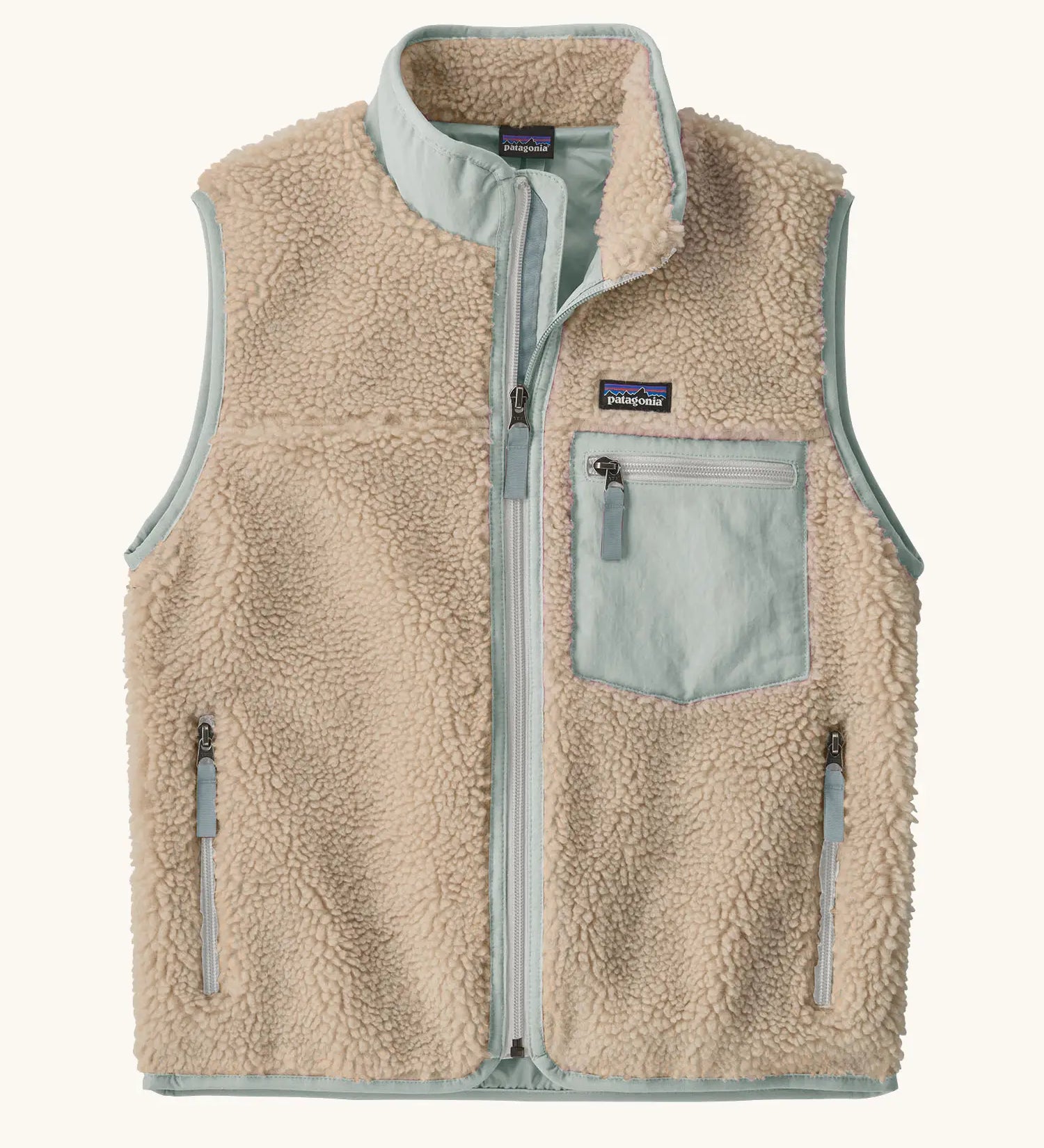 Patagonia Kids Retro X Fleece Jacket Vest in Natural with Virtually blue. soft cream fleece, contrasting pale blue binding, and a matching blue chest pocket.