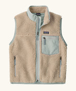 Patagonia Kids Retro X Fleece Jacket Vest in Natural with Virtually blue. soft cream fleece, contrasting pale blue binding, and a matching blue chest pocket.