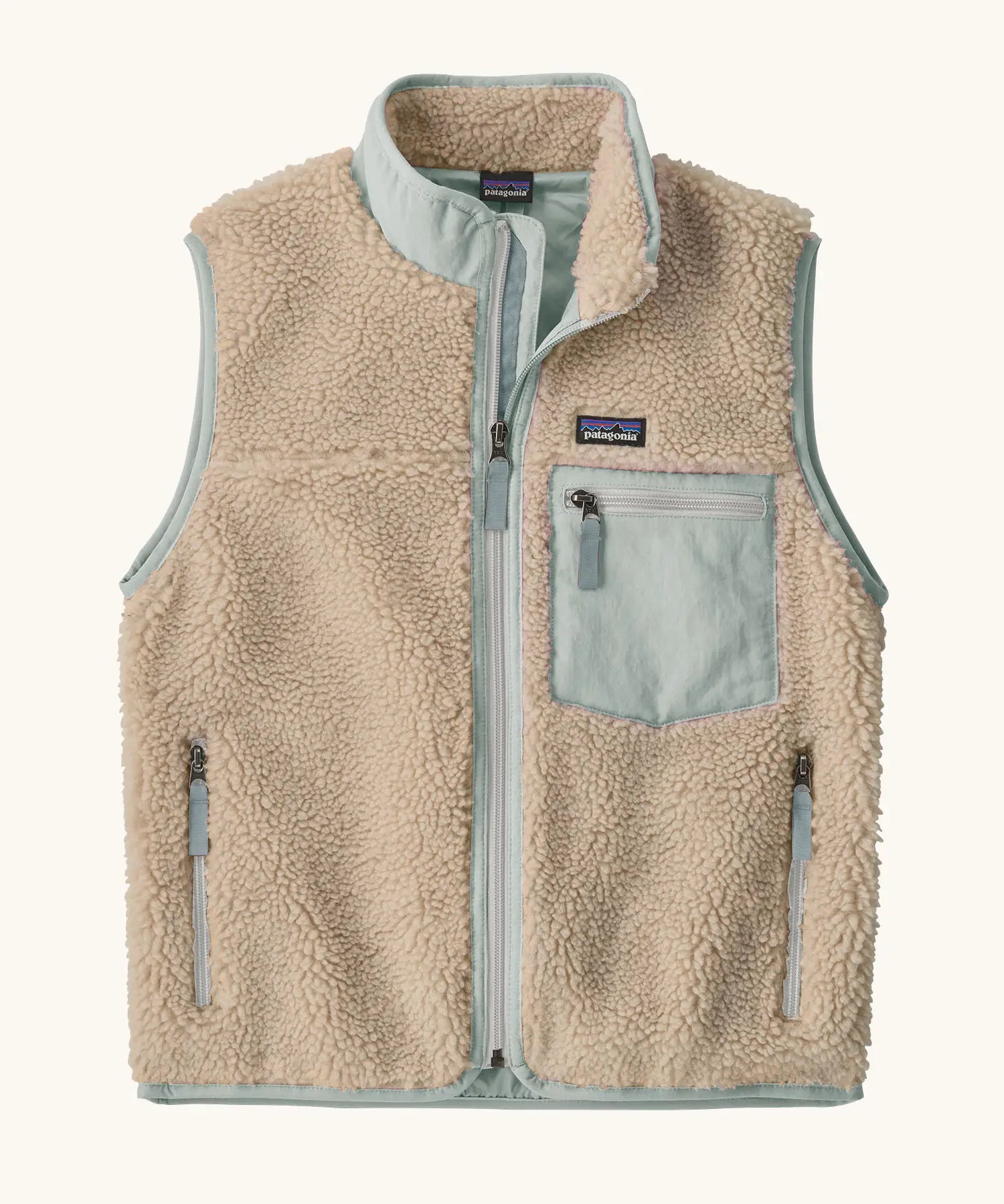 Patagonia Kids Retro X Fleece Jacket Vest in Natural with Virtually blue. soft cream fleece, contrasting pale blue binding, and a matching blue chest pocket.
