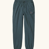 Patagonia Kids cotton Sweatpants in Fitz Roy Massif: summit blue. dark slate blue body with a small mountain line graphic on the hip.