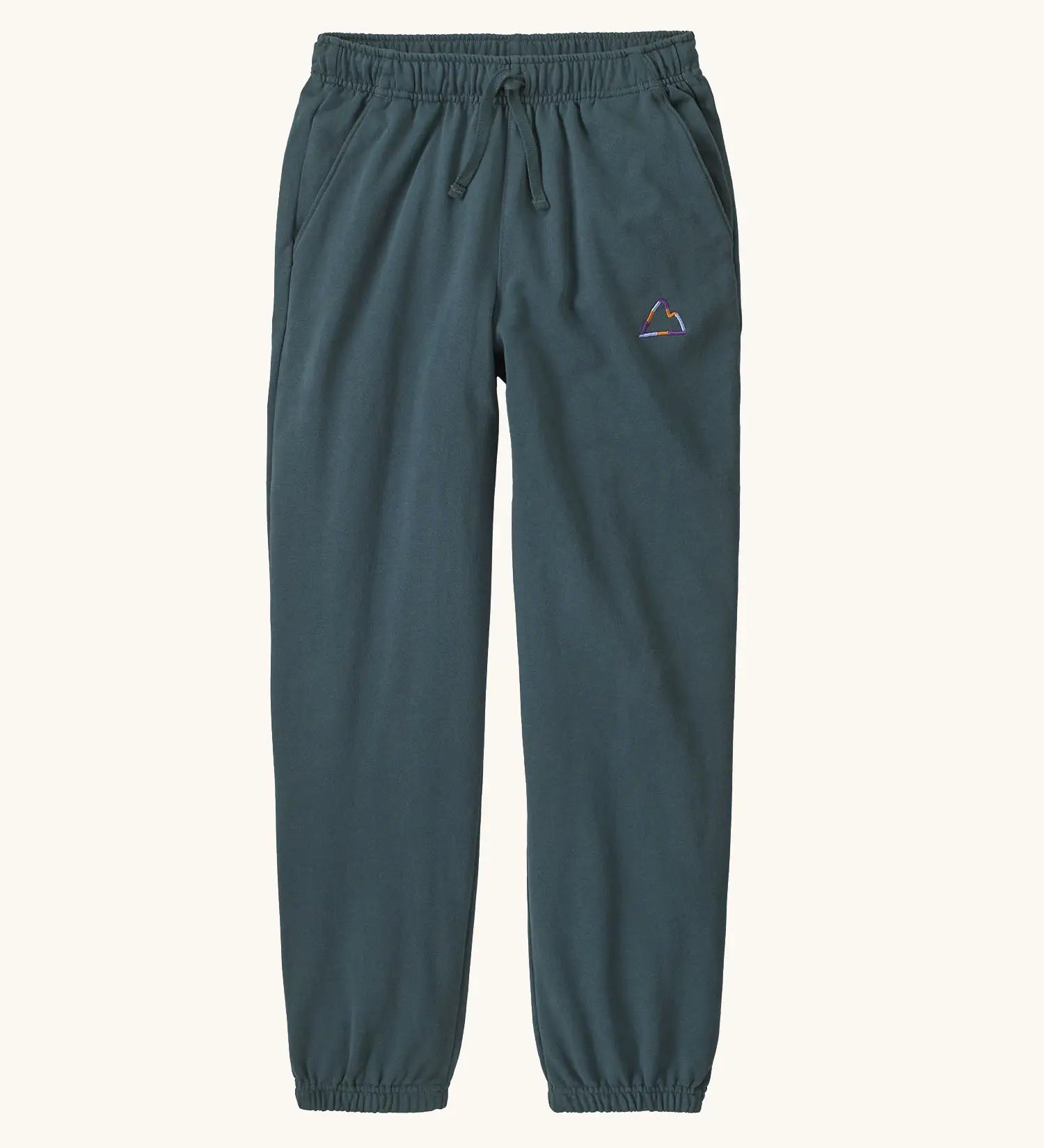 Patagonia Kids cotton Sweatpants in Fitz Roy Massif: summit blue. dark slate blue body with a small mountain line graphic on the hip.
