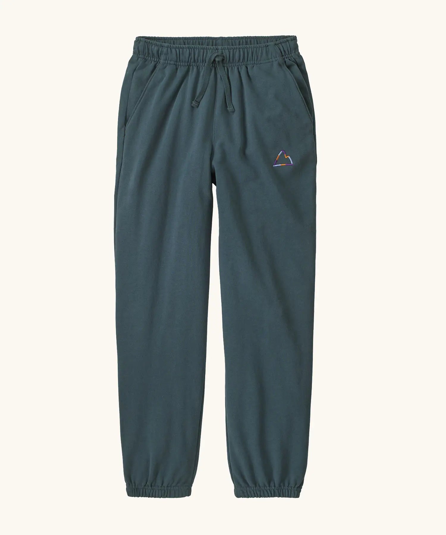 Patagonia Kids cotton Sweatpants in Fitz Roy Massif: summit blue. dark slate blue body with a small mountain line graphic on the hip.