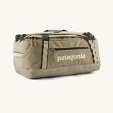 Patagonia black hole 40l duffel bag in light green with black zip details and cream printed logo on front panel