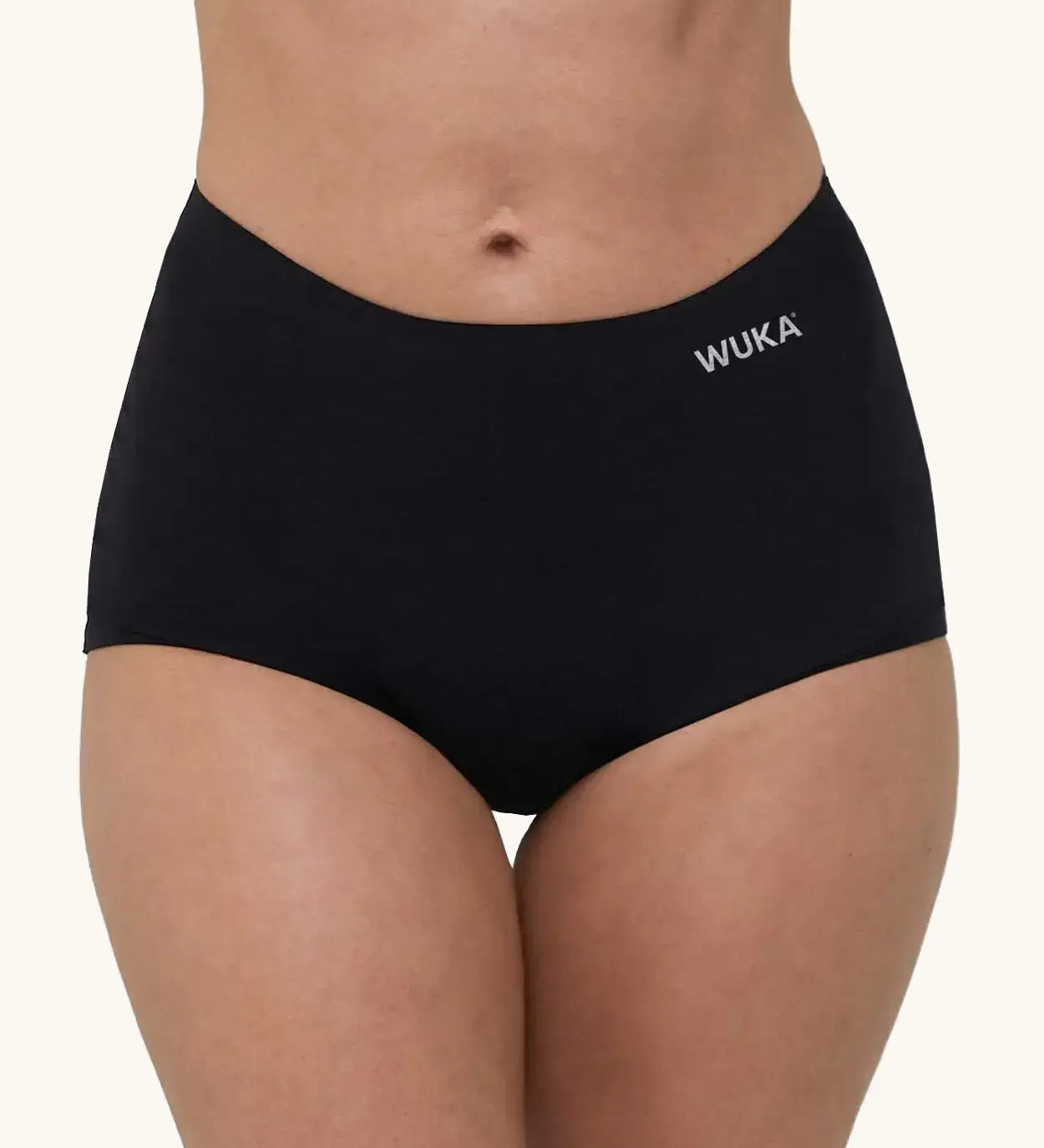A pair of WUKA adult stretch heavy flow period boxers in black with white branding text on the side