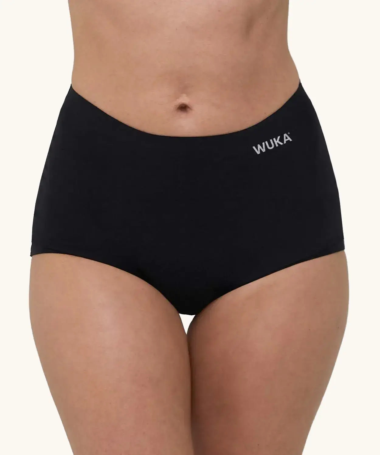 A pair of WUKA adult stretch heavy flow period boxers in black with white branding text on the side