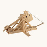 The Walachia Wooden Trebuchet building set, with the movable arm bent back, ready to fire the small wooden ball inside.