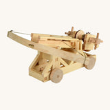 Assembled wooden ballista building set with tensioned arms and wheeled base, showing a finished Walachia wooden STEM toy construction model