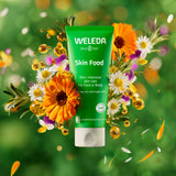 Weleda 30ml moisturising skin food available at Babipur infront of a bright, colourful floral background.