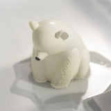 The Oli &amp; Carol Polar Bear Bath Toy Set made from 100% Natural Rubber, stood on its base, floating on water