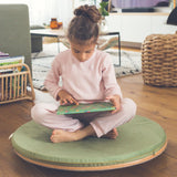 Wobbel 360 padded cushion deck in green, covering a Wobbel 360 wooden circle balance board.