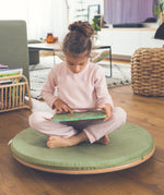 Wobbel 360 padded cushion deck in green, covering a Wobbel 360 wooden circle balance board.