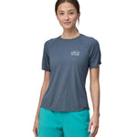 An adult showing the fit of the Patagonia Women's Capilene Cool Trail Graphic Shirt from the front.