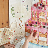 Wonderie play cloth everlasting birthdat cake with Grapat wooden decorating pieces.