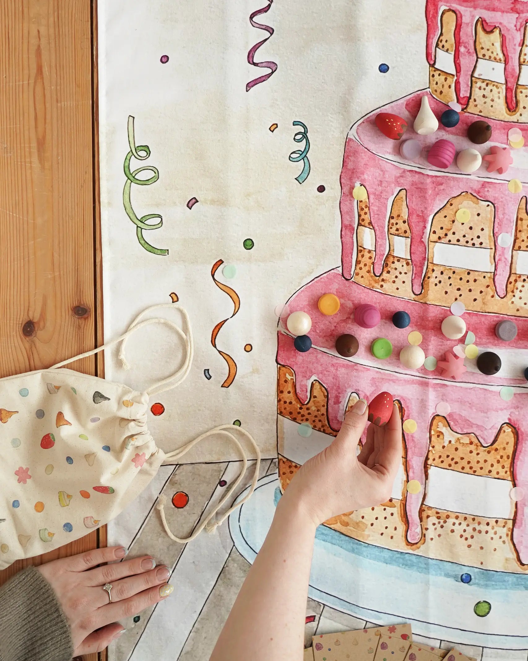 Wonderie play cloth everlasting birthdat cake with Grapat wooden decorating pieces.
