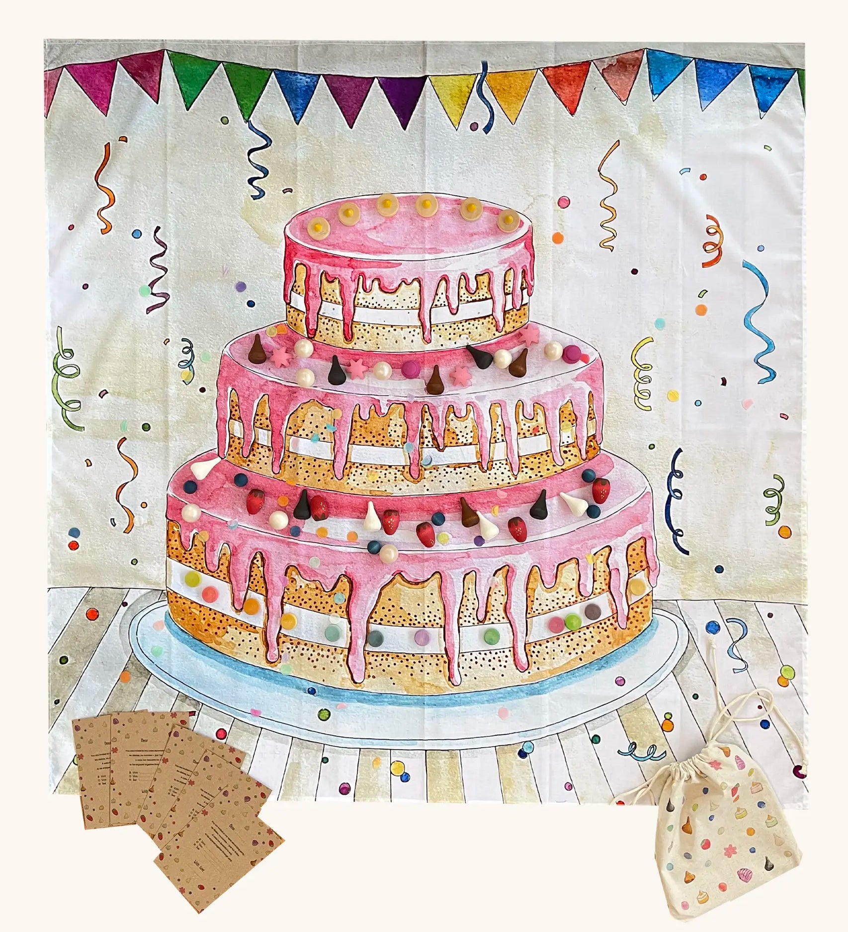 Wonderie cake play cloth, a three tier birthday play cloth with 60 Grapat wooden play food decoration pieces and paper invitations.
