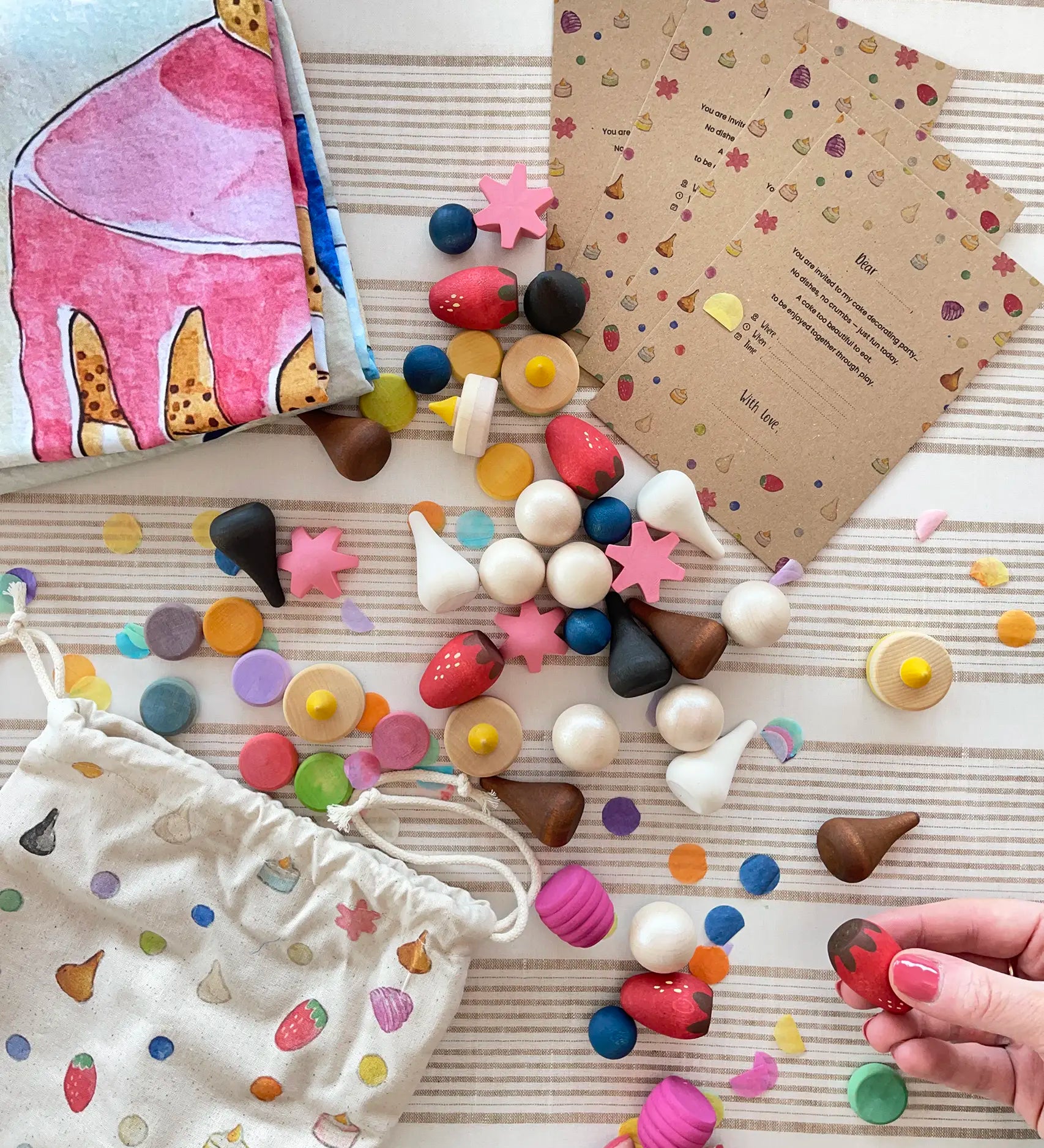 Wonderie cake play cloth set with 60 wooden Grapat play food pieces and invitations.