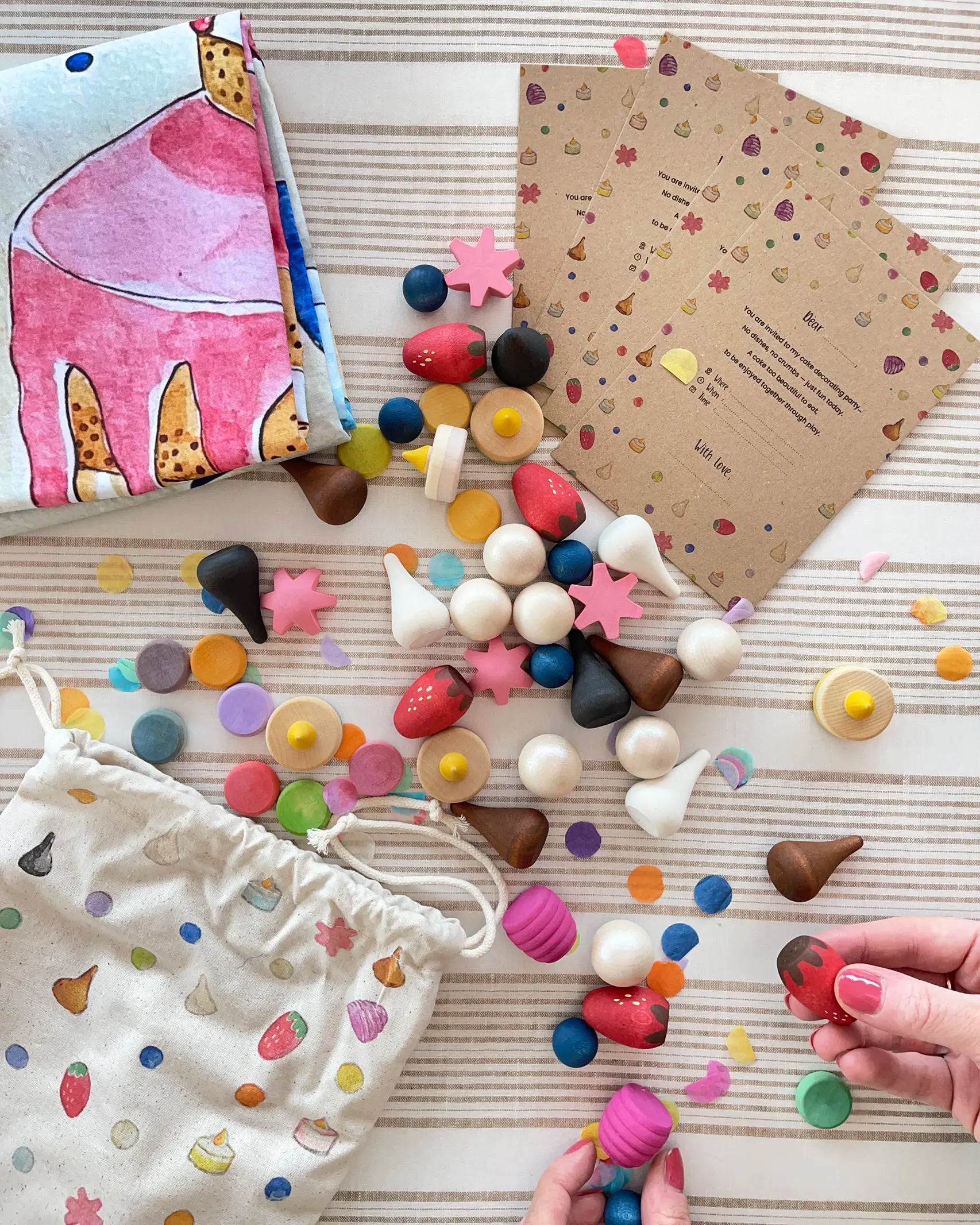 Wonderie cake play cloth set with 60 wooden Grapat play food pieces and invitations.