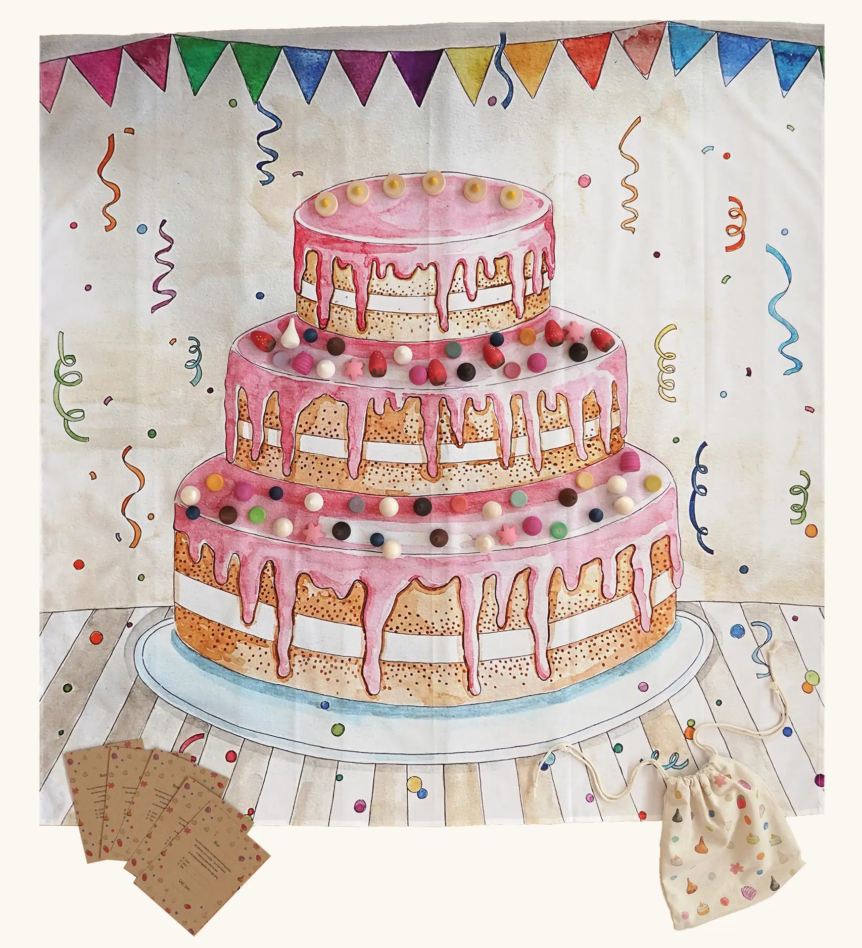 Wonderie cake play cloth, a three tier birthday play cloth with 60 Grapat wooden play food decoration pieces and paper invitations.