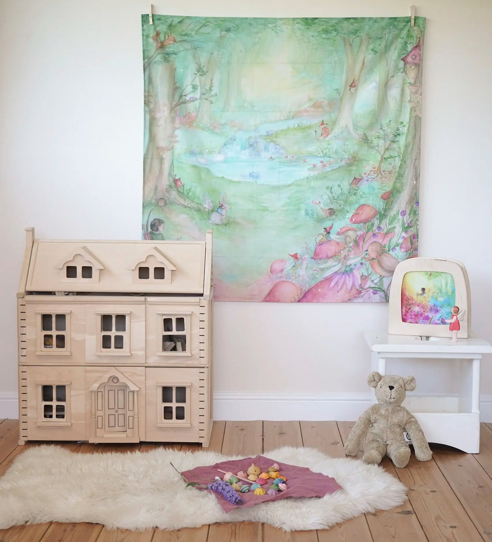 Wonderie forest of wonders play cloth, cotton cloth with fairies, toadstools and woodland creatures, as a wall hanging in the Babipur playroom.