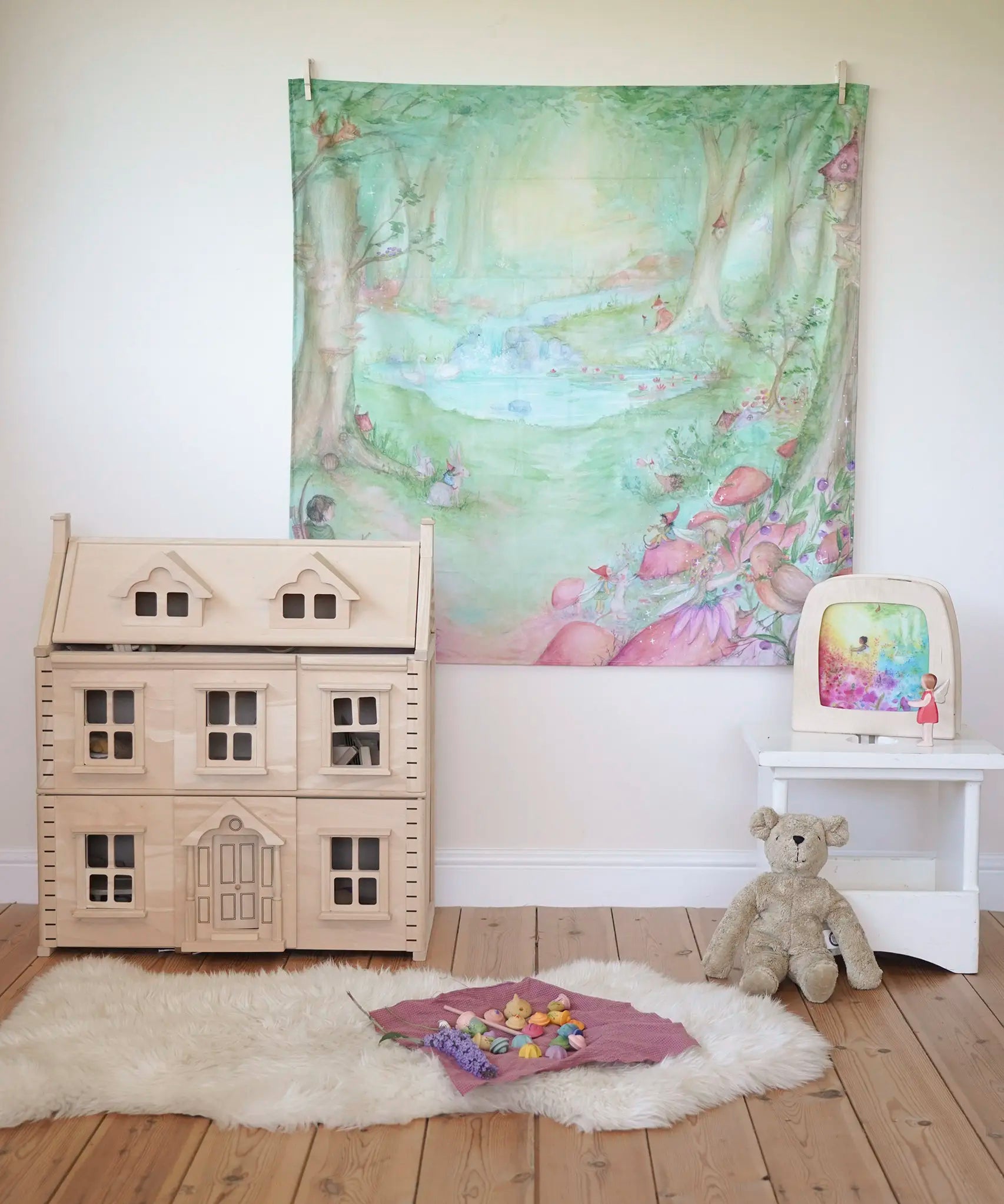 Wonderie forest of wonders play cloth, cotton cloth with fairies, toadstools and woodland creatures, as a wall hanging in the Babipur playroom.