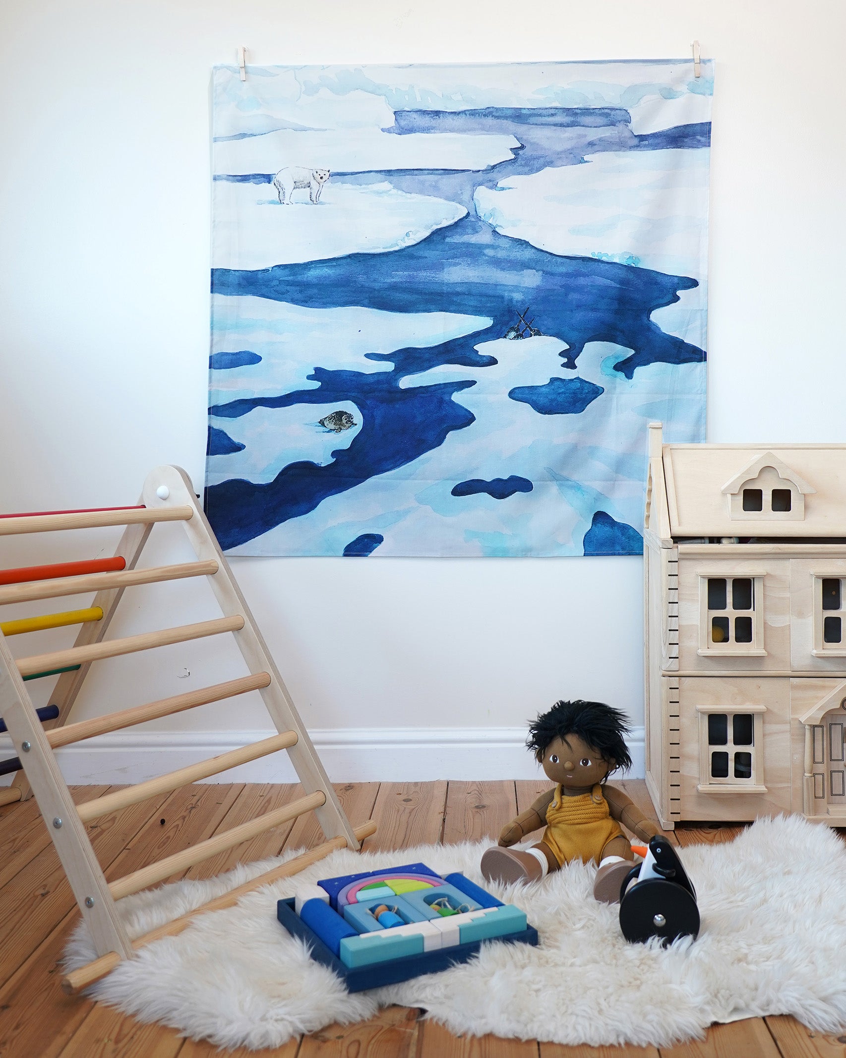 An organic cotton Frozen Land Arctic toy play cloth by Wonderie hung up in the Babipur playroom, you can also use is as a backdrop or play base, buy now at Babipur.
