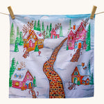 Wonderie Play Cloth - Gingerbread Lane, is a lovey sensory play cloth with 
a beautifully hand-illustrated festive scene, featuring a red brick path through a snowy village filled with enchanting gingerbread houses, with sugar icing roofs, candy canes lining the paths and snow-covered fir trees