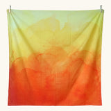 Wonderie organic cotton large sheer play cloth in orange and yellow amber for fire, summer and volcano small world play.
