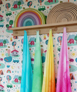 Wonderie organic cotton sheer large play cloths in green, blue, yellow and pink in the Babipur playroom.