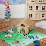 Wonderie organic cotton large sheer play cloth in juniper green used as grass in a farm small world play set up with Bbaipur animals and Lanka Kade barn.