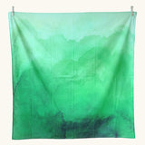 Wonderie organic cotton large sheer play cloth in juniper green to use as grass in spring and summer small world play.