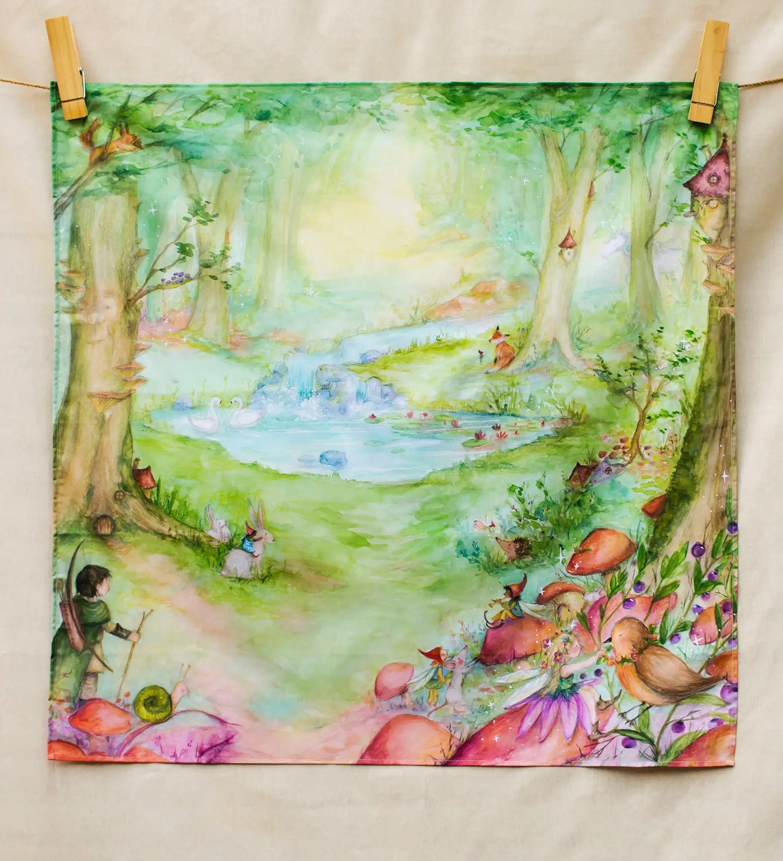Wonderie Play Cloth featuring the forest of wonders design. Hand illustrated fairytale theme drawings featuring a archer, pixies, mushrooms, river and small pond