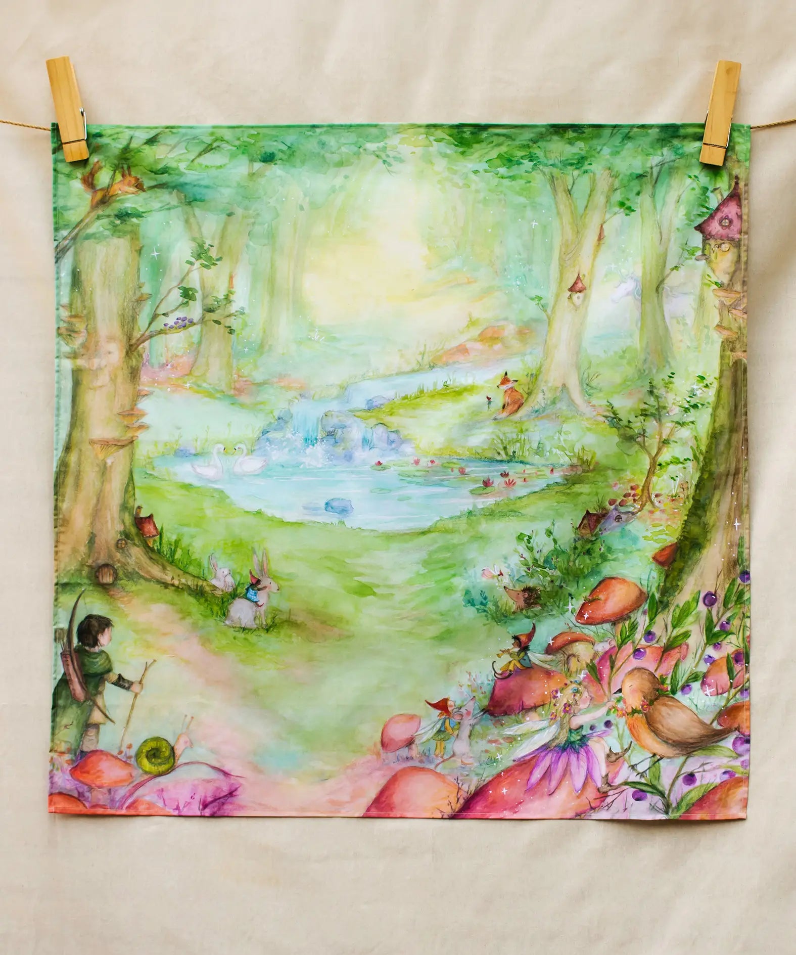 Wonderie Play Cloth featuring the forest of wonders design. Hand illustrated fairytale theme drawings featuring a archer, pixies, mushrooms, river and small pond