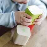A closer image of the Tegu wooden magnetic blocks showing the natural wood grain