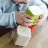 A closer image of the Tegu wooden magnetic blocks showing the natural wood grain