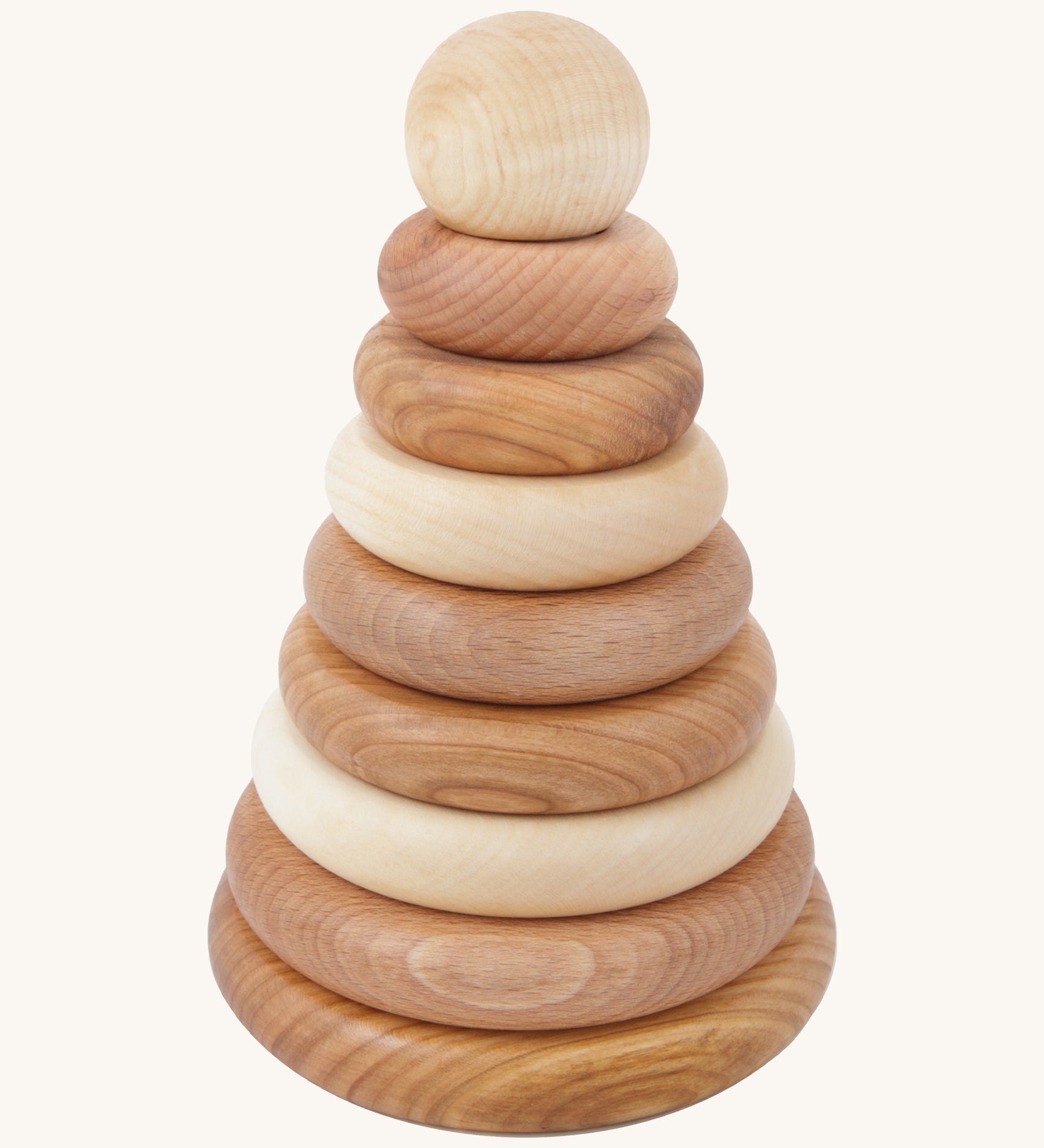Wooden story natural round pyramid Montessori stacking toy available a Babipur. A unpainted rounded stacking toy with 8 pieces and a base