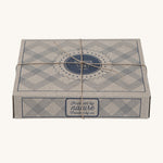 The cardboard decorative box for the Wooden Story Rattles, which comes beautifully wrapped in brown string. The perfect gift for little ones.