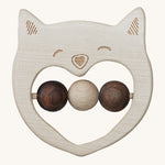 The Wooden Story Smiley Cat Rattle, is a beautiful wooden, sensory toy, perfect for teething. The rattle has a cat face on the front, and three wooden beads in the middle. 2 in dark wood and 1 in light wood. The image is on a cream background