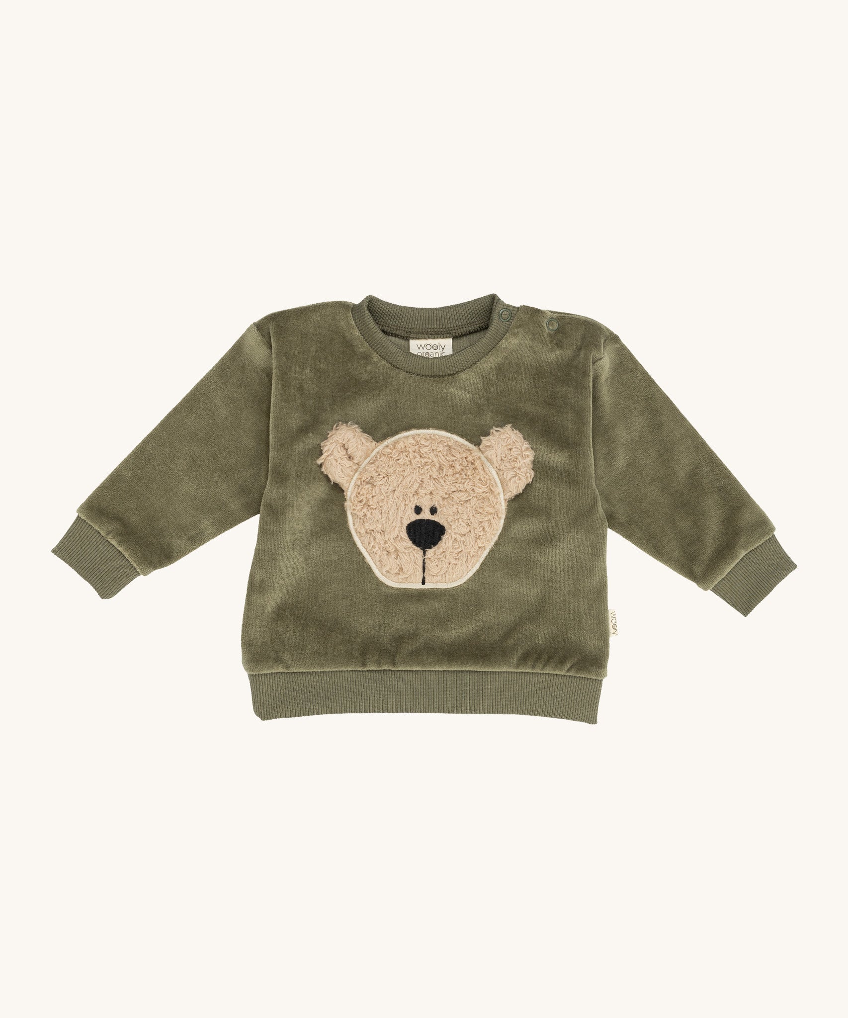 Wooly Organic embroidered sweater in tea leaf /savannah available at Babipur. A soft GOTS organic cotton jersey sweater in light green with a cute fluffy cream teddy bear on the front. Features popper fasteners on the shoulder for a easy fit
