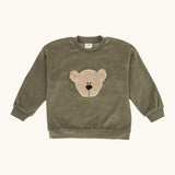 Wooly Organic embroidered velour sweater in tea leaf /savannah available at Babipur. A soft GOTS organic cotton velour sweater in light green with a cute fluffy cream teddy bear on the front.