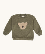Wooly Organic embroidered velour sweater in tea leaf /savannah available at Babipur. A soft GOTS organic cotton velour sweater in light green with a cute fluffy cream teddy bear on the front.