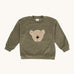 Wooly Organic embroidered velour sweater in tea leaf /savannah available at Babipur. A soft GOTS organic cotton velour sweater in light green with a cute fluffy cream teddy bear on the front.