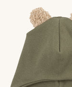 A close up of the Wooly Organic hat with teddy ears in tea leaf / savannah available at Babipur showing the cute fluffy teddy bear ears detail