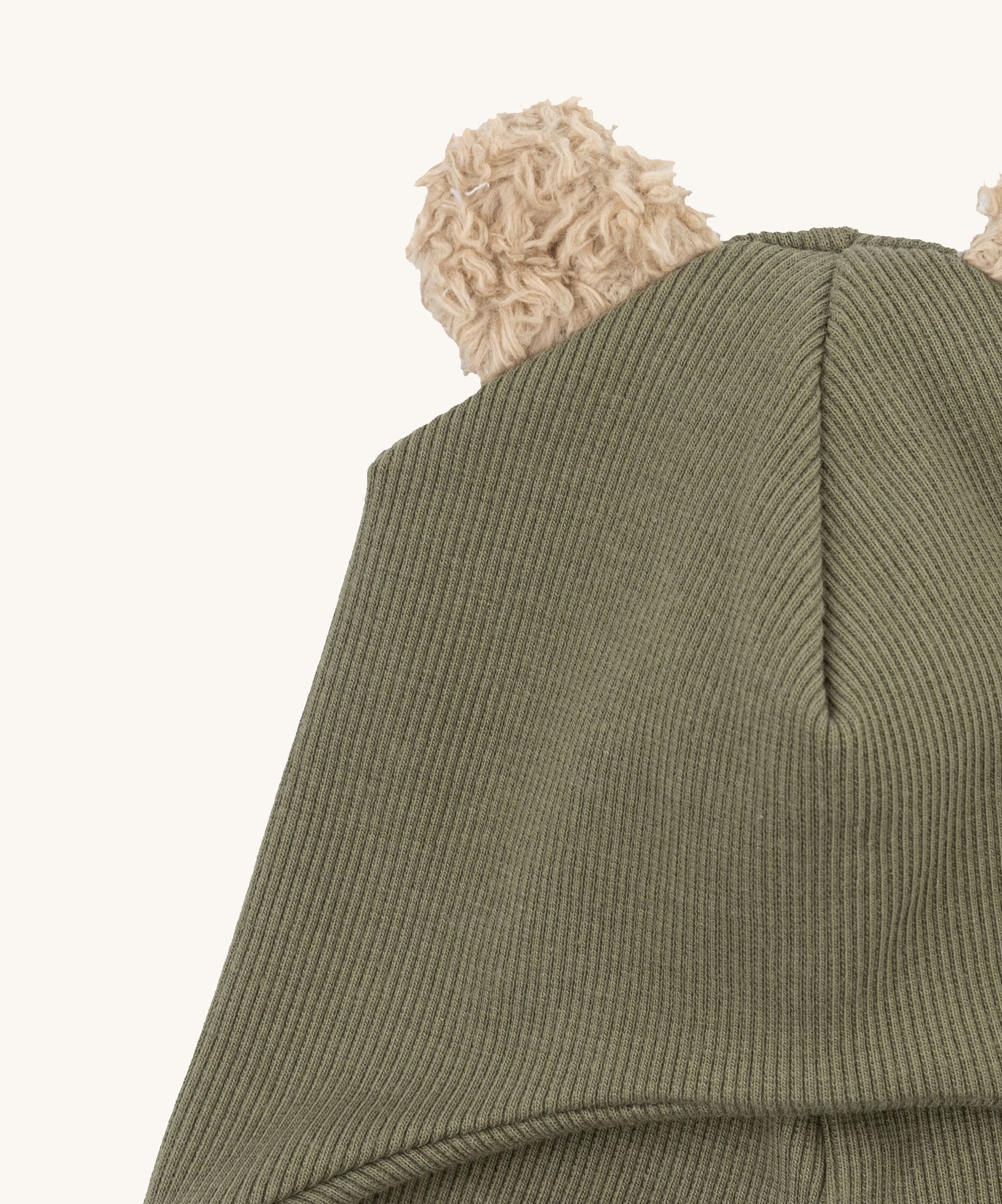 A close up of the Wooly Organic hat with teddy ears in tea leaf / savannah available at Babipur showing the cute fluffy teddy bear ears detail