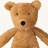 A close up of the A small Wooly Organic soft teddy bear in brown available at Babipur showing the cute facial features