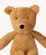 A close up of the A small Wooly Organic soft teddy bear in brown available at Babipur showing the cute facial features