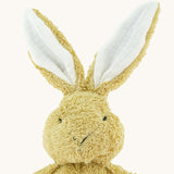 A close up of the small Wooly Organic soft bunny rabbit in amber available at Babipur showing the cute facial features and floppy ears