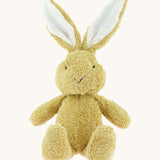 A small Wooly Organic soft bunny rabbit in amber available at Babipur. A soft cotton light brown rabbit with cute facial features and floppy ears