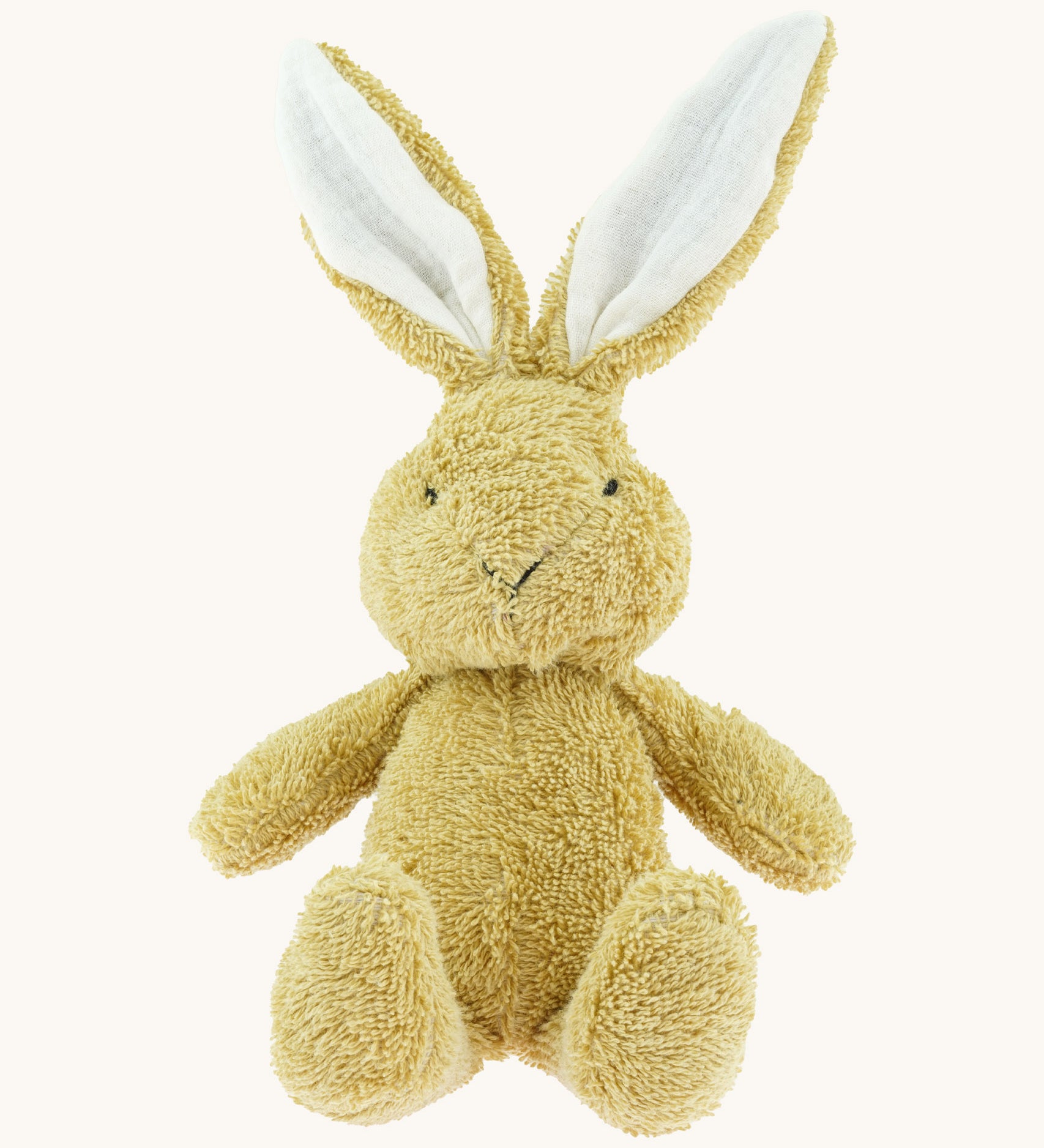 A small Wooly Organic soft bunny rabbit in amber available at Babipur. A soft cotton light brown rabbit with cute facial features and floppy ears